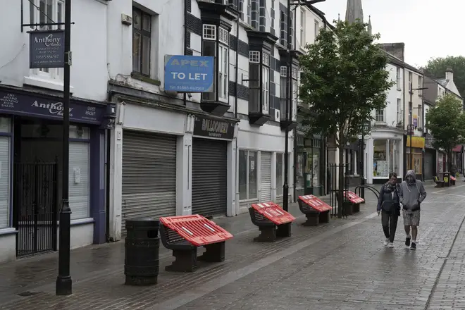File photo: A man and woman walk down Commercial Street in Aberdare