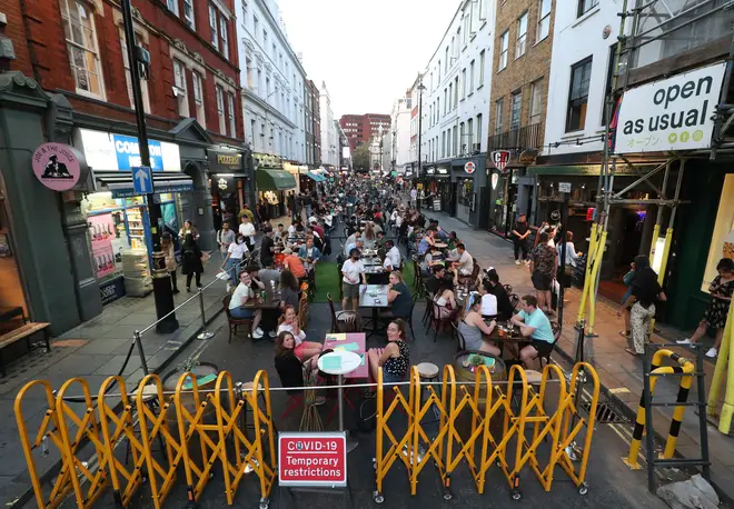 People drinking and dining out in Soho, London