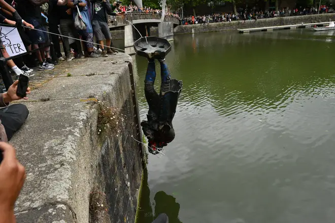 Protesters throw statue of Edward Colston into Bristol harbour