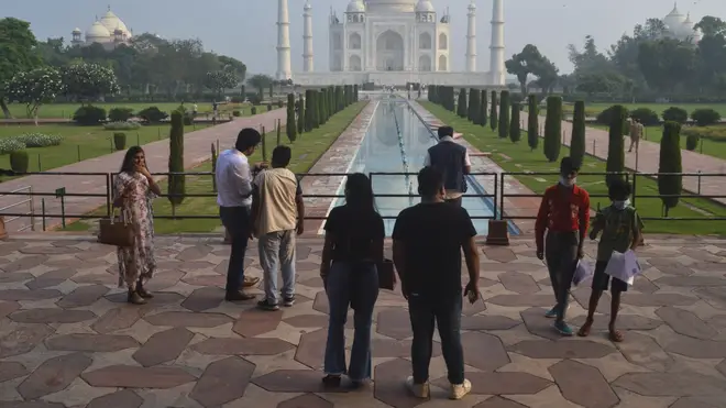 A small number of tourists visit as the Taj Mahal monument is reopened after being closed for more than six months due to the coronavirus pandemic in Agra, India