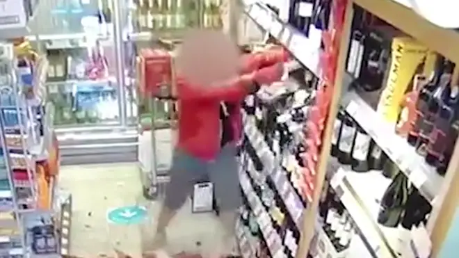 The furious shopper smashed up wine bottles after appearing to shout at staff
