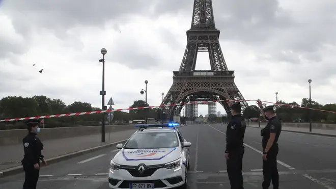 French police officers secure the bridge leading to the Eiffel Towe