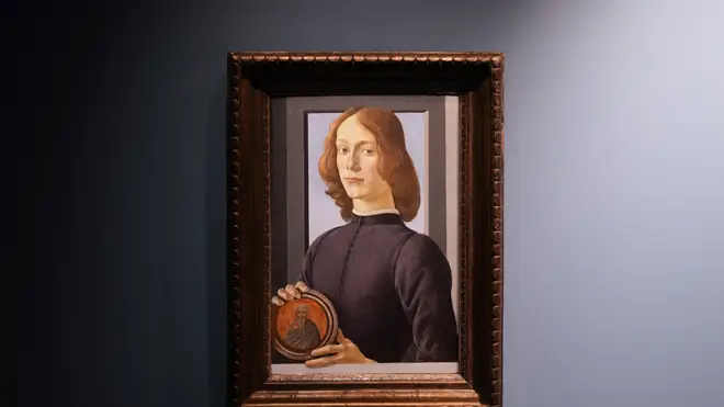 Sandro Botticelli’s 15th-century painting, Young Man Holding a Roundel, is displayed at Sotheby’s