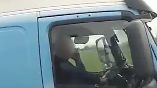 Lorry driver caught using his phone behind the wheel.