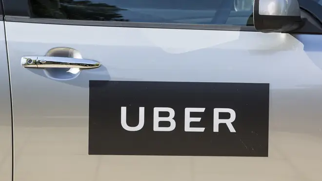 An Uber logo on a car door (Laura Dale/PA)