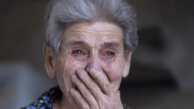 Ethnic Armenian Rosa after her house was damaged during shelling in the town of Martuni