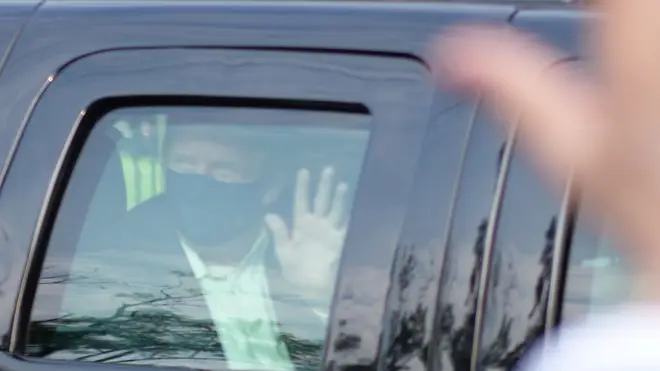 Donald Trump waved to supporters outside Walter Reed, where he is currently being treated for coronavirus