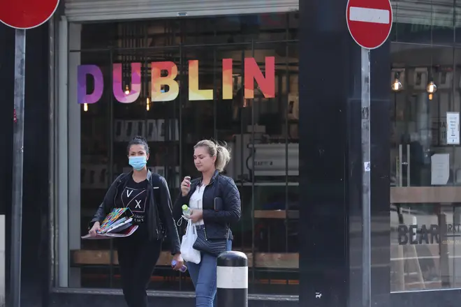 File photo: A person wearing a mask (left) in Dublin city centre