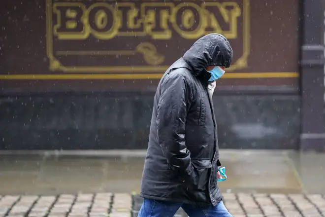 File photo: A man walks on the street in Bolton, Greater Manchester
