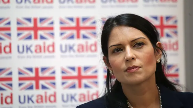 Priti Patel is flying home from a trip to Africa