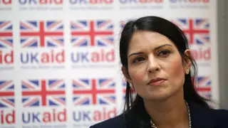 Priti Patel is flying home from a trip to Africa