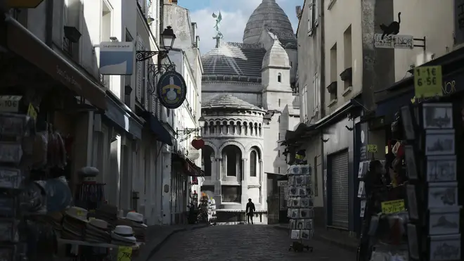Tourists shops are empty in a deserted street just outside the Sacre Coeur basilica in the Montmartre district of Paris (Lewis Joly/PA)