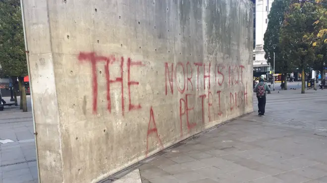 Graffiti stating 'the North is not a petri dish' was sprayed onto a wall in Manchester overnight