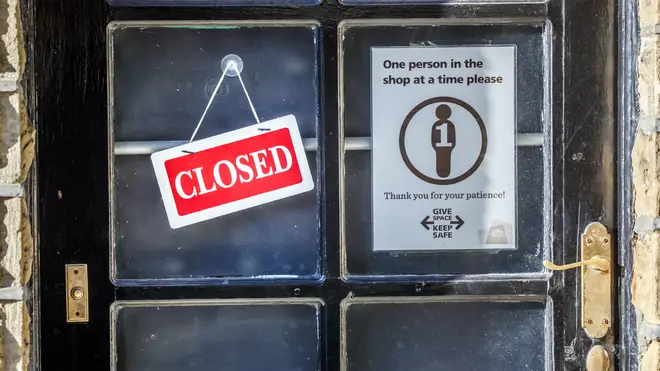 A 'Closed' sign on a shop door