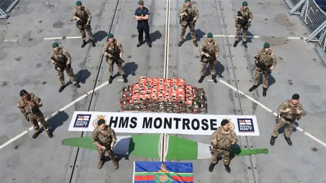 An HMS Montrose boarding team pose with the drugs