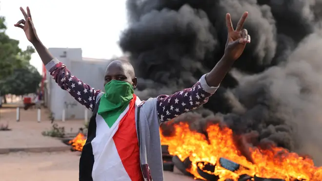 A demonstrator gives the victory sign at a protest, in Khartoum, Sudan (Marwan Ali/AP)