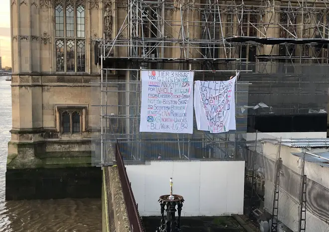 The man unfurled the banners on scaffolding close to Big Ben