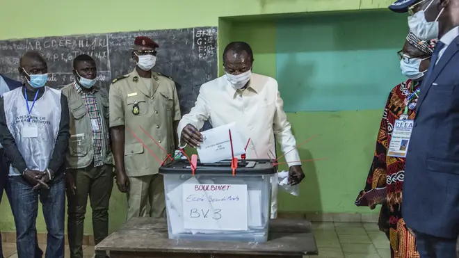 Guinean President Alpha Conde casts his ballot