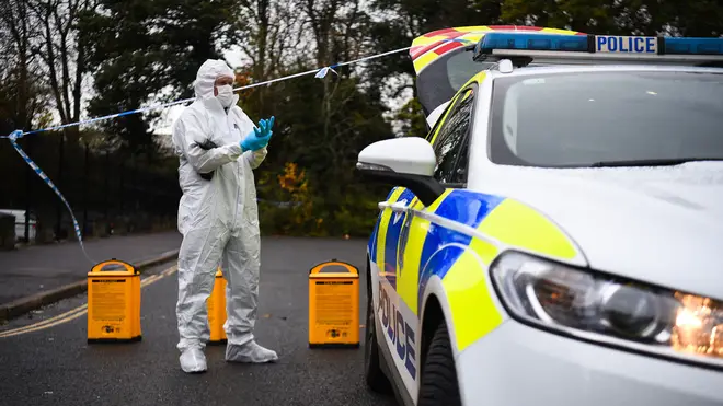 A forensic officer at the scene on Russell Way in Crawley, West Sussex, after a 24-year-old man was fatally stabbed