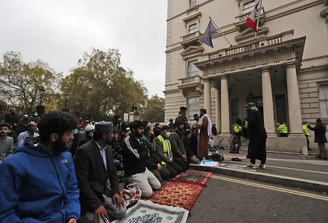 Protesters briefly paused their demonstration in a moment of prayer