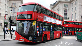London buses turn the corner onto Piccadilly Circus