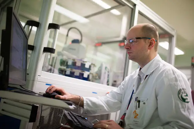 File photo of an AstraZeneca technician helping develop a Covid-19 vaccine