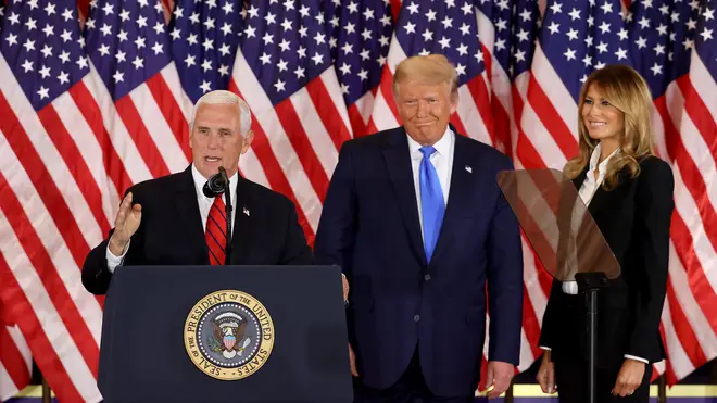 Donald Trump appears alongside Vice President Mike Pence on election night
