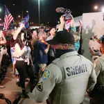 Police and protesters outside the Election Centre in Phoenix, Arizona