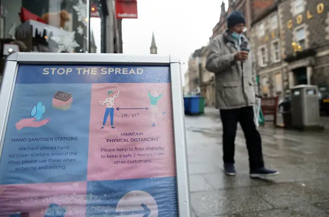 A sign advising customers about the spread of coronavirus outside a shop in Stirling