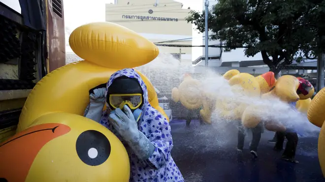 Pro-democracy protesters take cover with inflatable ducks