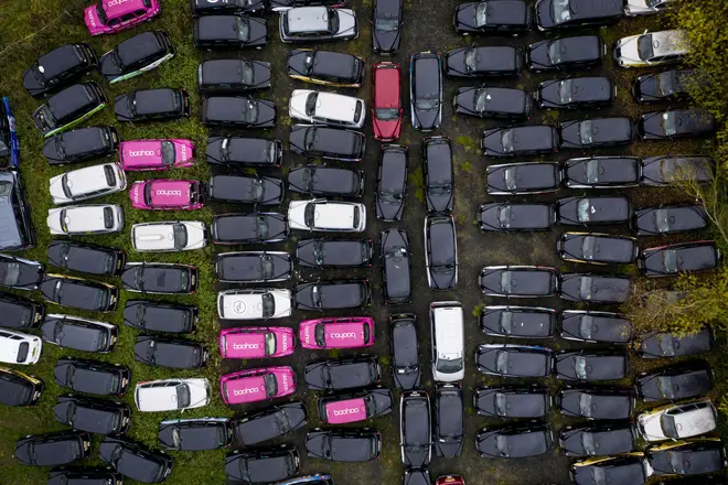 Fields and car parks are being hired by taxi firms to store cabs taken off the road