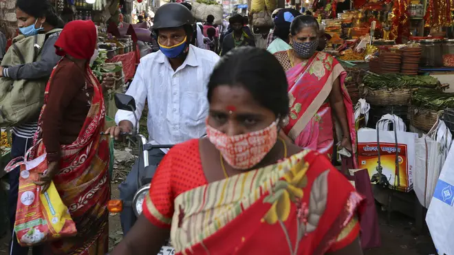 A woman wears a mask in India