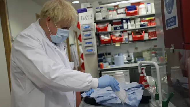Boris Johnson, pictured visiting the Oxford vaccine centre, is to outline plans for new Tiers later