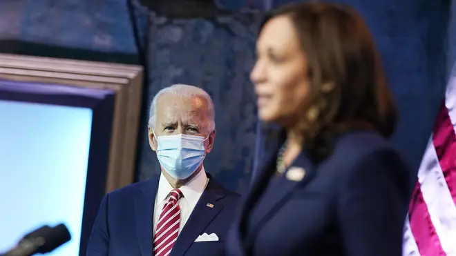 President-elect Joe Biden listens to Vice President-elect Kamala Harris (Andrew Harnik/AP)