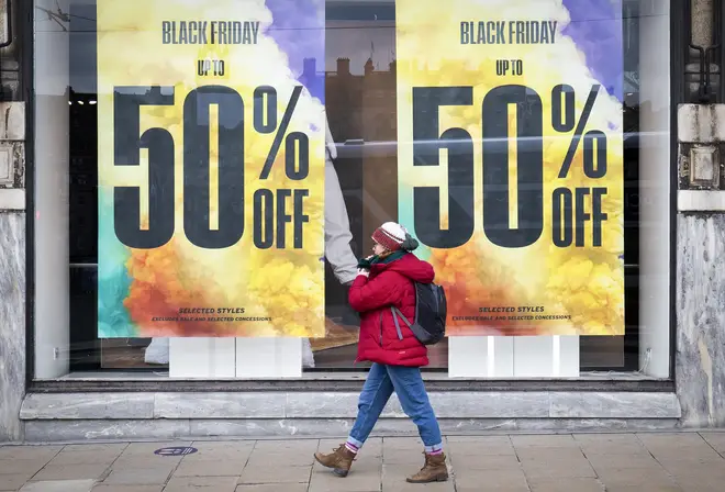 Shops along Princes Street in Edinburgh display posters and signs advertising sales ahead of Black Friday