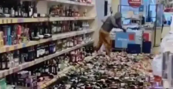 The woman smashed "over 500 bottles of alcohol"