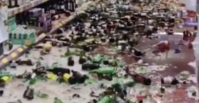 Bottles can be seen strewn across the floor as alcohol runs everywhere