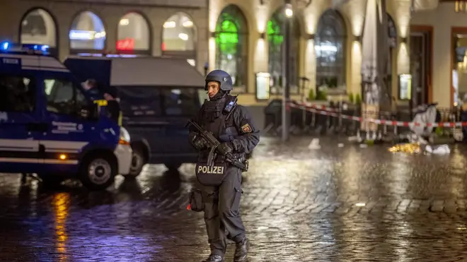 A police officer guards evidence at the scene of the incident in Trier, Germany (Michael Probst/AP)