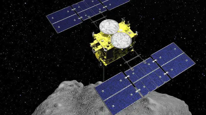 The Hayabusa2 spacecraft above the asteroid Ryugu