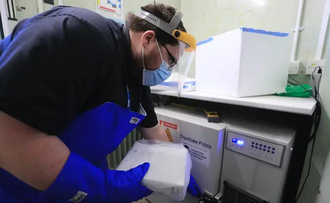 A pharmacy technician prepares to store the first delivery of Covid-19 vaccine at Croydon University Hospital