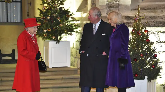 Queen Elizabeth II talks with Prince Charles and Camilla, Duchess of Cornwall
