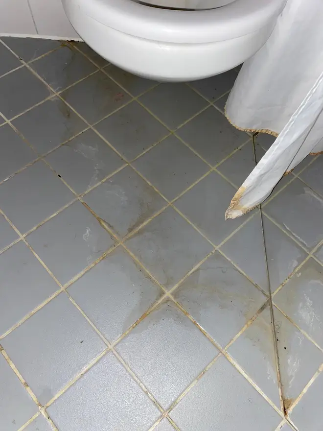 Luke Sullivan from Goldsmiths says this was "urine stained" bathroom floor of his £8,300 a year accommodation when he moved in.