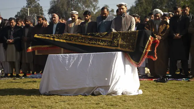 Afghans pray for TV presenter Malala Maiwand during her funeral ceremony in Jalalabad