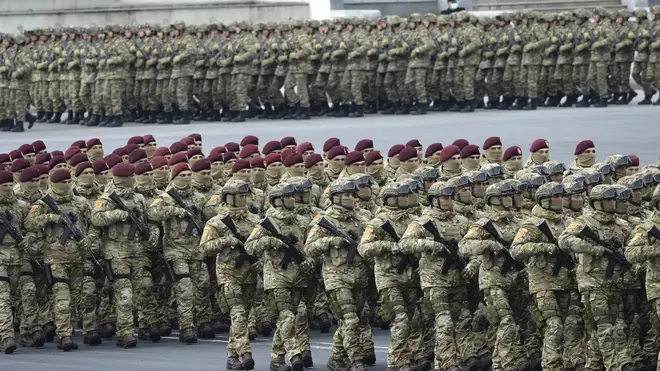 Azerbaijani troops march during the parade in Baku