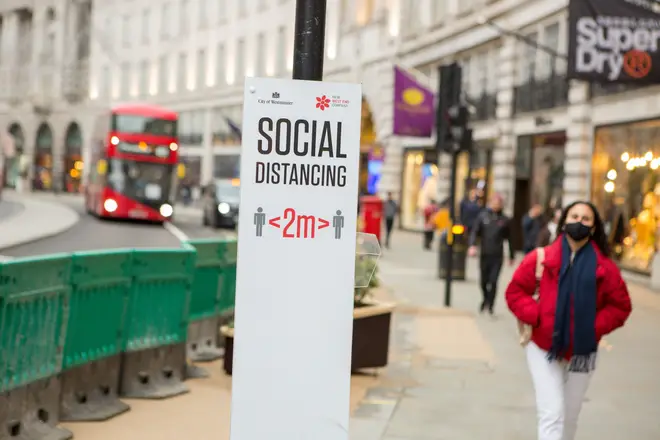 File photo: Social distancing sign on Regent St, London