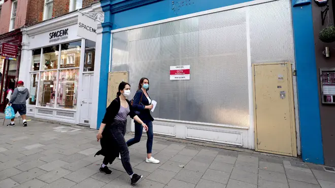 Boarded up shops on Islington High Street as the council announced the closure of all schools