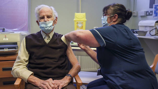 Brian Horne receives a dose of the Pfizer/BioNtech vaccine at a GP led clinic in Buckinghamshire