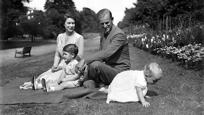Princess Elizabeth, with the Duke of Edinburgh, and their two children, Prince Charles, and Princess Anne, in the grounds of Clarence House in 1951