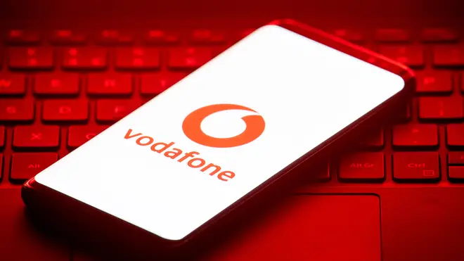 The Vodafone logo on a smartphone