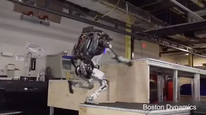 Atlas the robot jumps onto three blocks as it does a 'parkour'